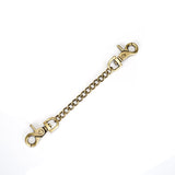 Brass-colored bondage accessory chain with clip hooks for vegan leather ankle cuffs