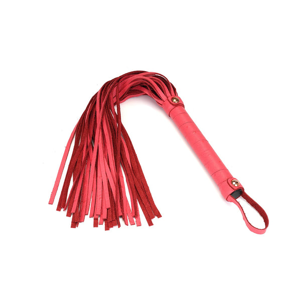 Cherry blossom pink leather flogger with rose gold studs and ostrich skin pattern handle from Angel's & Demon's Kiss collection