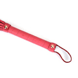 Cherry blossom pink leather flogger with rose gold studs and wrist loop from Angel's & Demon's Kiss collection