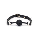 Demon's Kiss breathable silicone ball gag with black leather straps and golden hardware for bondage play