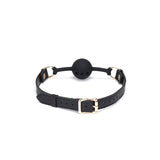Demon's Kiss breathable silicone ball gag with black leather straps and ostrich skin pattern, featuring golden buckle and studs for BDSM play