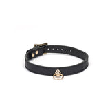 Black leather bondage collar with ostrich skin pattern and gold O-ring from the Demon's Kiss collection