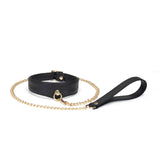 Luxurious black leather BDSM collar with ostrich skin pattern and golden chain leash from the Demon's Kiss collection