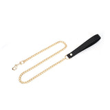 Luxurious black leather and gold chain leash from the Demon's Kiss collection, perfect for stylish BDSM fetish wear