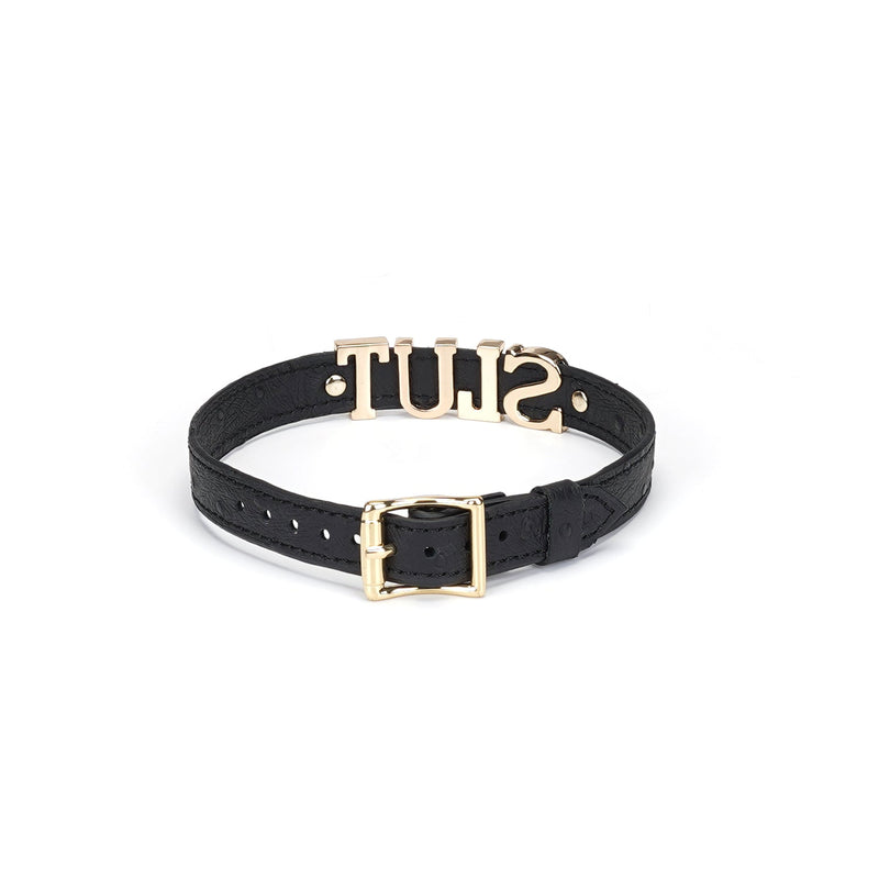 Black leather bondage collar with 'SLUT' in silver letters and gold buckle, from the Angel's & Demon's Kiss collection