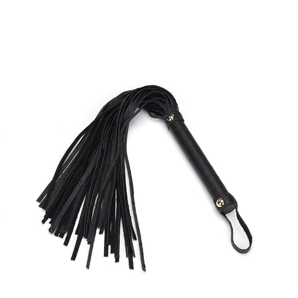 Black leather flogger whip from Demon's Kiss collection with gold studs and wrist loop for BDSM impact play