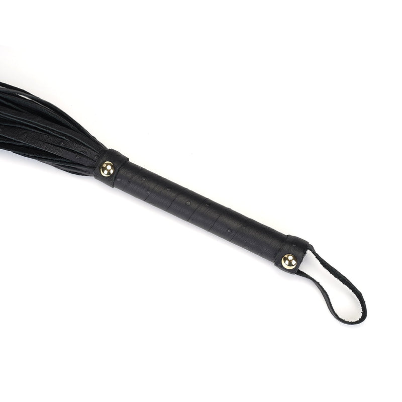 Black leather flogger whip with golden studs and ostrich pattern handle from the Angel's & Demon's Kiss collection