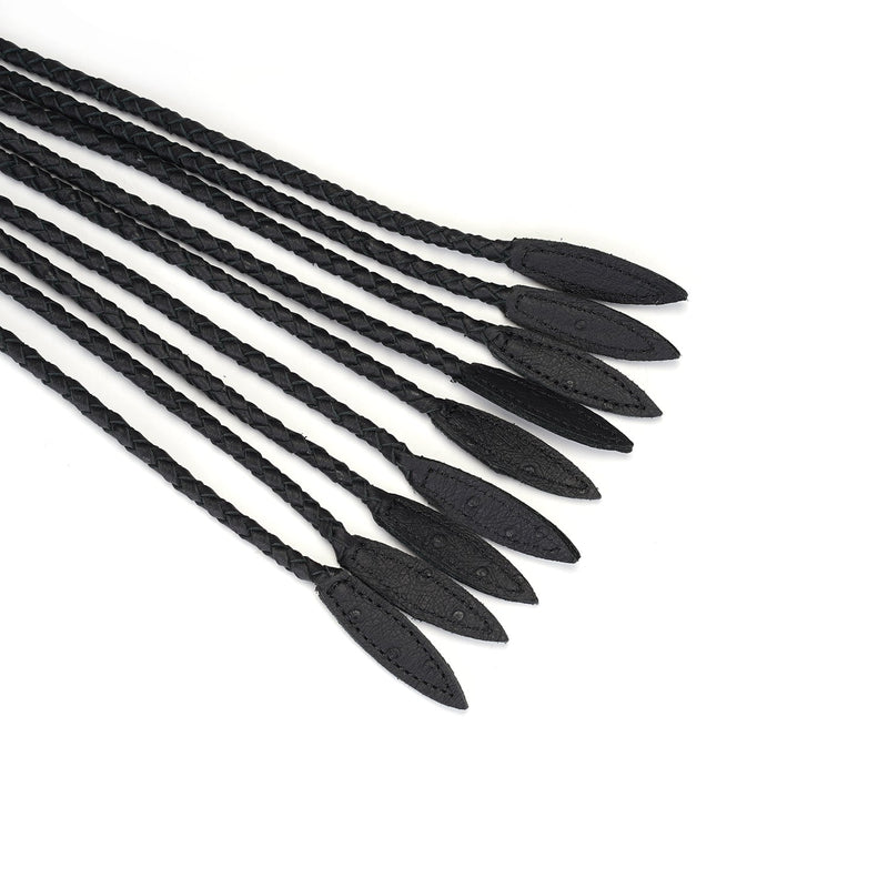 Close-up of black leather cat o' nine tails with braided tails and pointed tips from Demon's Kiss collection