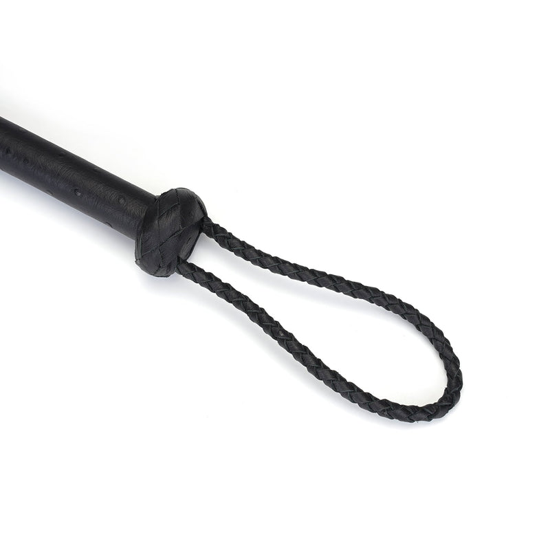 Luxurious black leather cat o' nine tails flogger from the Demon's Kiss collection, featuring a braided handle and nine plaited tails for advanced bondage play