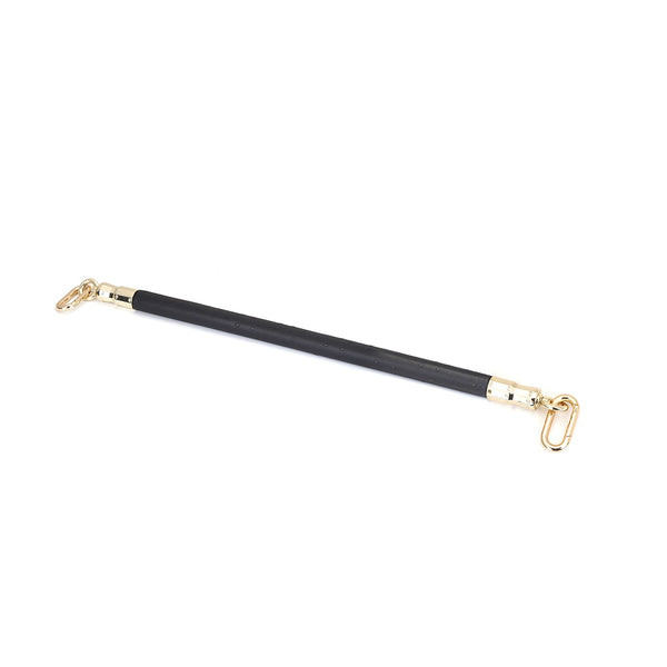 Black leather-coated spreader bar with ostrich skin pattern and gold hardware for BDSM play from the Angel's & Demon's Kiss collection