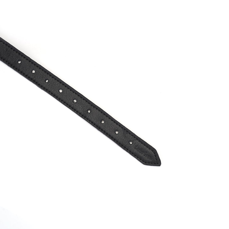 Close-up of adjustable black leather strap with silver buckle holes for the Dark Secret leather bondage blindfold