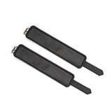 Luxurious black leather ankle cuffs with gold hardware from the Dark Secret collection, designed for bondage play