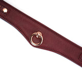 Wine Red leather bondage collar with rose gold ring and adjustable settings, part of luxurious BDSM collection