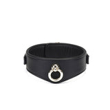 Black leather bondage collar with gold-tone metal ring from Dark Secret collection, adjustable and padded for BDSM play
