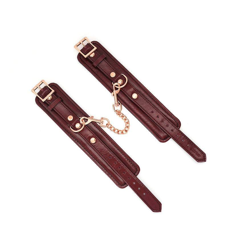 Wine Red leather handcuffs with rose gold hardware from LIEBE SEELE's bondage wrist restraints collection