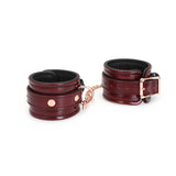 Wine red leather wrist cuffs with rose gold accents from LIEBE SEELE advanced bondage kit