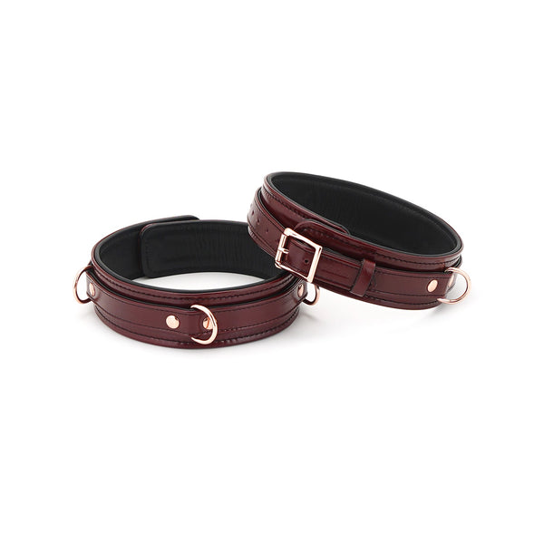 Luxurious wine red leather thigh cuffs with rose gold hardware from LIEBE SEELE's bondage accessories collection