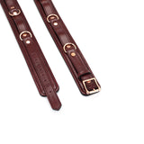 Luxury wine red leather thigh cuffs with rose gold hardware for BDSM play, adjustable and high-quality