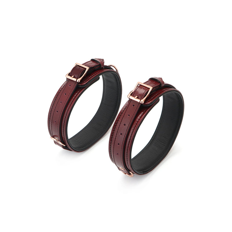 Wine red leather bondage thigh cuffs with rose gold buckles and detailing from the LIEBE SEELE Red Wine collection