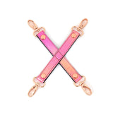 Glossy pink leather hogtie with rose gold clasps from the Vivid Sakura soft bondage kit