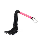 Vivid Sakura flogger from glossy pink soft bondage kit with black leather tassels and shiny pink handle