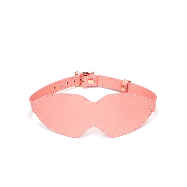 Baby pink leather bondage blindfold with rose gold buckle, adjustable strap for sensual deprivation play