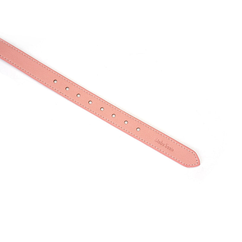 Close-up view of baby pink leather adjustable strap from the Pink Dream bondage collection by Liebe Seele