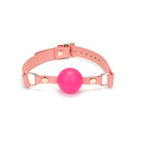 Pink leather ball gag with silicone ball and rose gold accents from the Pink Dream collection