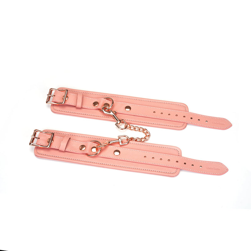 Pink Dream collection pink leather handcuffs with rose gold hardware and adjustable straps for bondage play