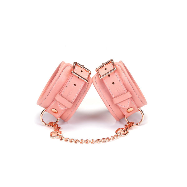 Pink Dream leather ankle cuffs with rose gold hardware and chain for colorful BDSM play