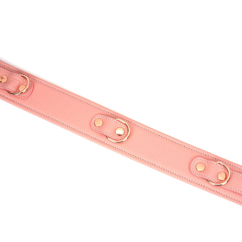 Pink leather bondage thigh cuff with rose gold hardware and D-rings from the Pink Dream collection