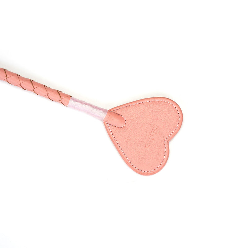Pink leather riding crop with heart-shaped tip from the Pink Dream collection, perfect for BDSM and impact play