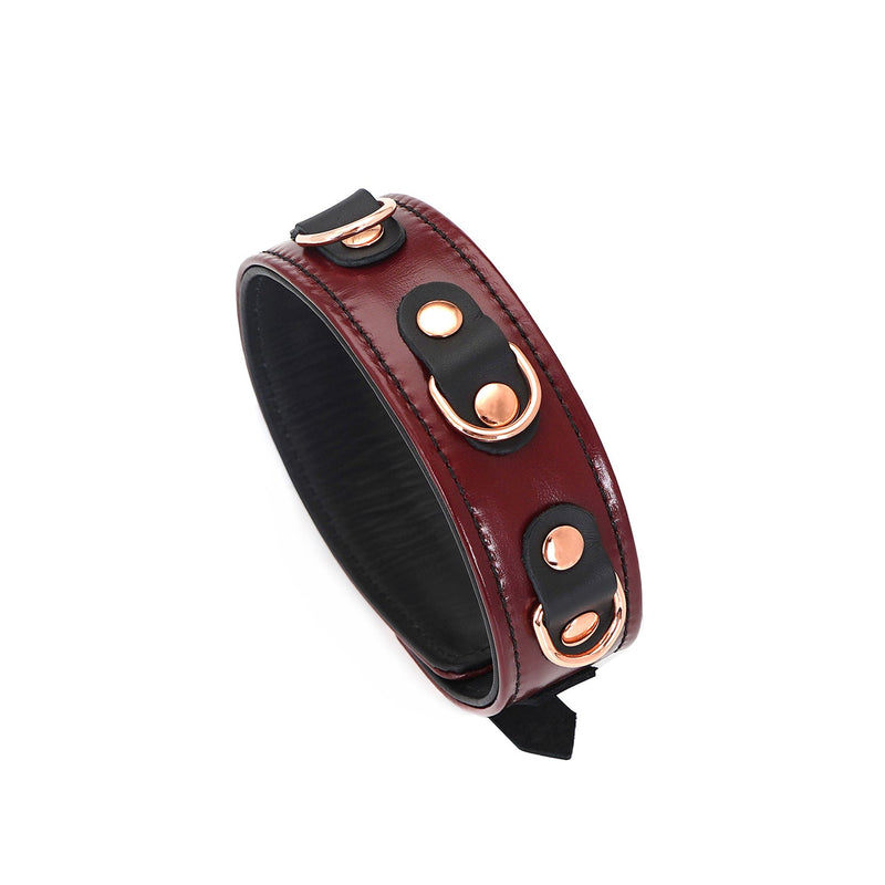 Wine Red leather bondage collar with rose gold metal buckles and black lining, from LIEBE SEELE's fetishwear collection