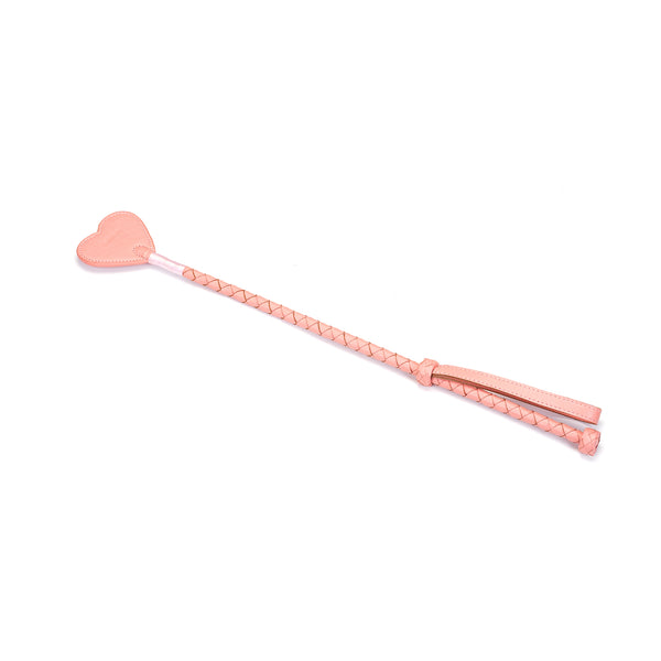 Pink leather riding crop with heart-shaped tip and braided handle from the Pink Dream collection, ideal for BDSM impact play