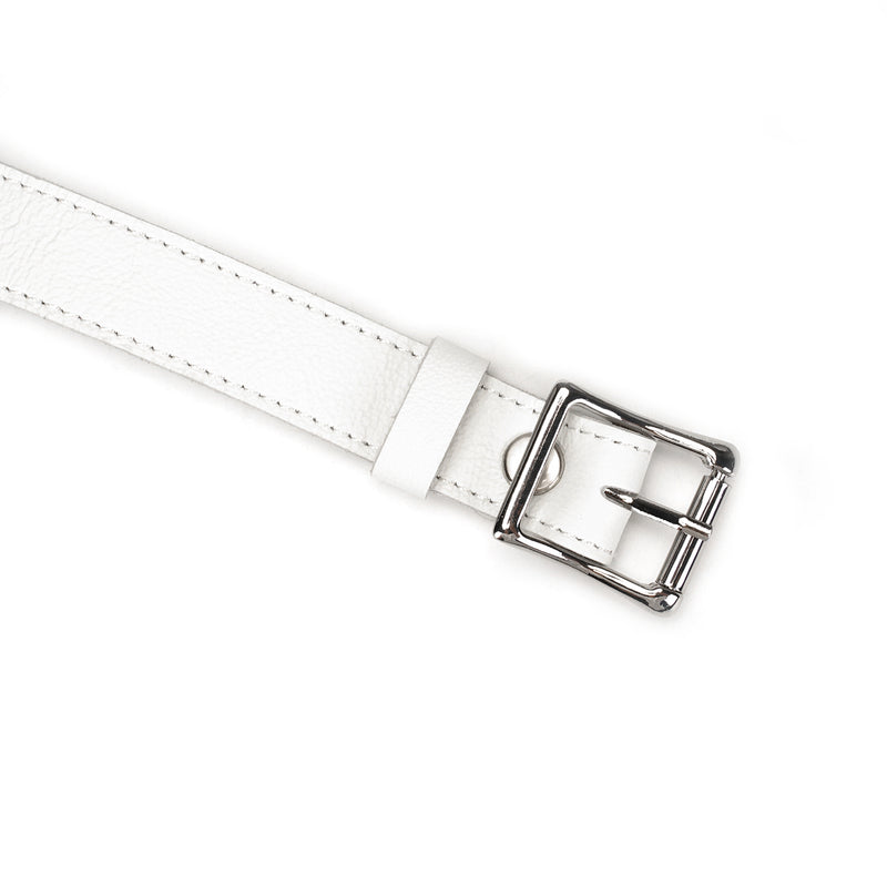 Close-up of white leather strap with silver buckle for Fuji White silicone ball gag, showcasing premium bondage gear craftsmanship