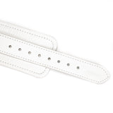 Close-up of white leather ankle cuff strap with silver metal buckle holes and detailed stitching, part of the Fuji White BDSM collection