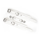 Fuji White leather handcuffs with silver metal buckles and quick-release clips, designed for safe and adjustable BDSM play