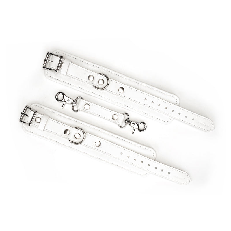 Fuji White leather handcuffs with silver metal buckles and quick-release clips, designed for safe and adjustable BDSM play