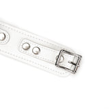 Close-up of white leather BDSM collar with silver buckle and adjustment holes, part of the Fuji White collection for elegant bondage play
