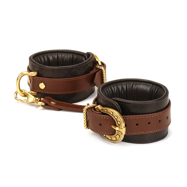 Luxury leather ankle cuffs from The Equestrian collection with vintage gold hardware and adjustable settings for bondage play
