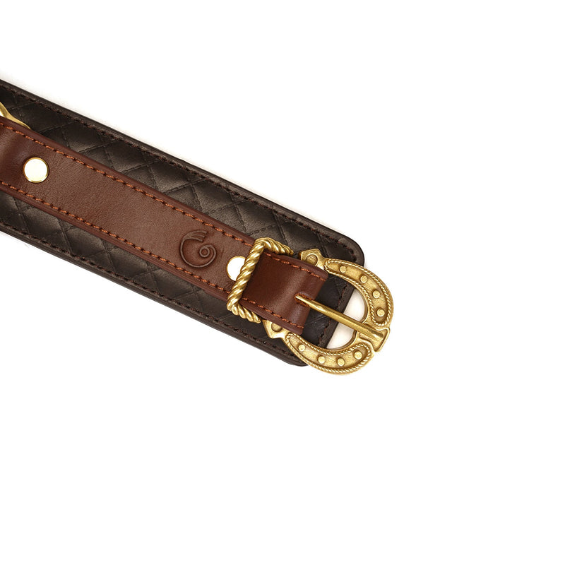 Close-up of The Equestrian luxury leather ankle cuff with vintage gold buckle and detailed stitching