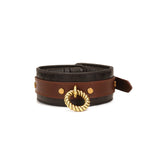 Luxury leather bondage collar with gold chain leash from The Equestrian collection, featuring rich brown and tan leather and vintage gold finishes