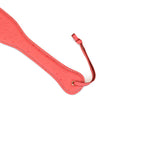 Cherry blossom pink leather spanking paddle with ostrich skin pattern and rose gold hardware from Angel's Kiss collection