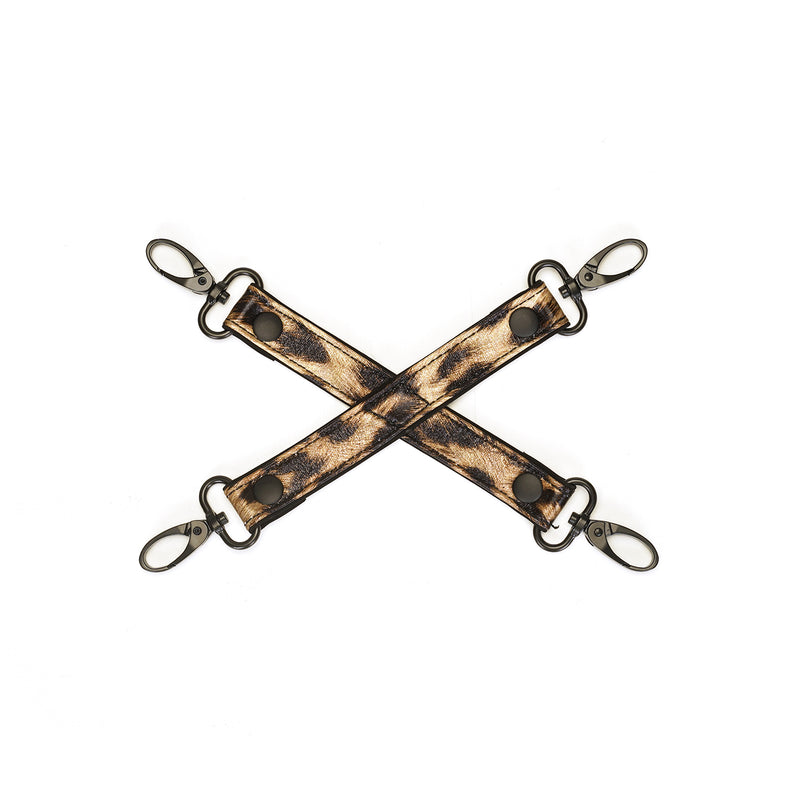 Leopard print hog-tie for bondage, with durable metal D-rings and clips, part of a complete beginners bondage kit