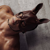 Man wearing The Equestrian leather bondage mask from LIEBE SEELE, highlighting vintage gold hardware and horse ear design