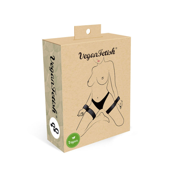 Vegan Fetish packaging showing wrist-to-thigh restraints, promoting cruelty-free and vegan bondage accessories