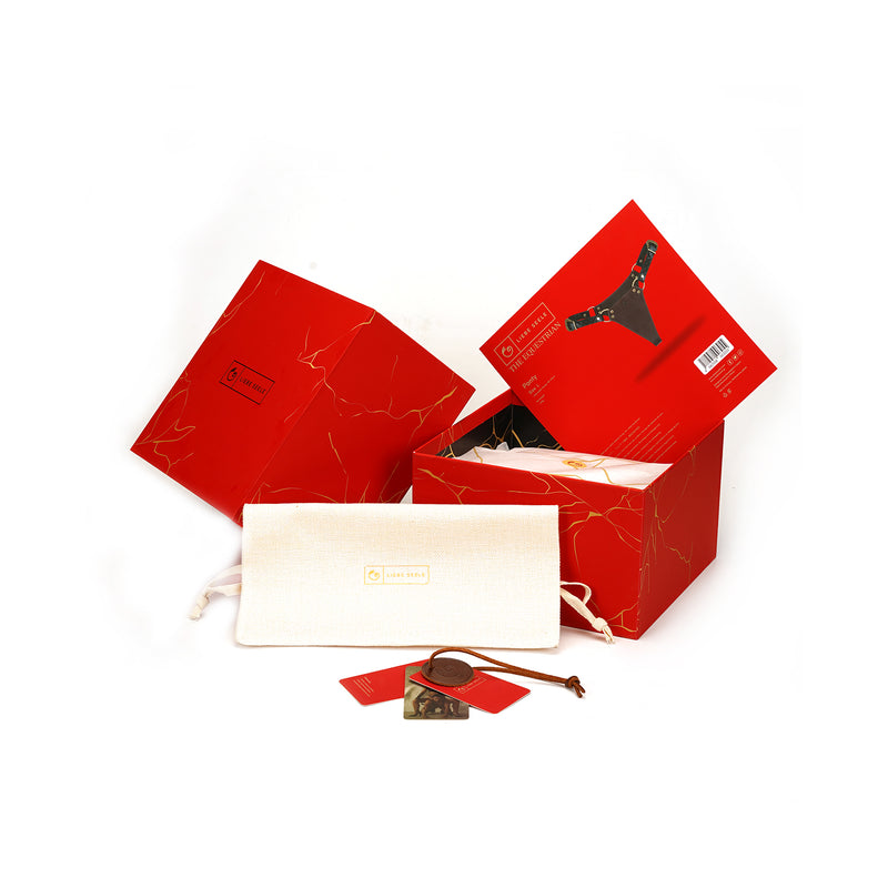 LIEBE SEELE The Equestrian leather panty packaging, featuring elegant red boxes with product graphics, a secure storage pouch, and branded tag