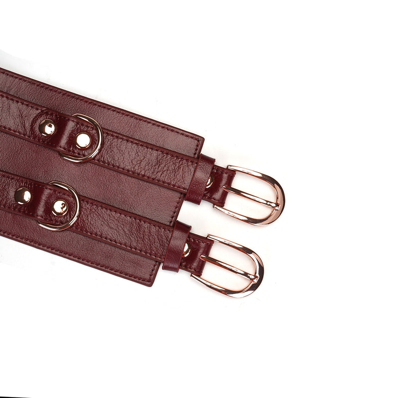 Wine red leather bondage waist belt with rose gold buckles for BDSM fantasy play, adjustable and part of the Wine Red collection