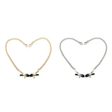 Gold and silver bull nose nipple clamps with adjustable rubber tips and metal chains arranged in heart shapes for bondage play