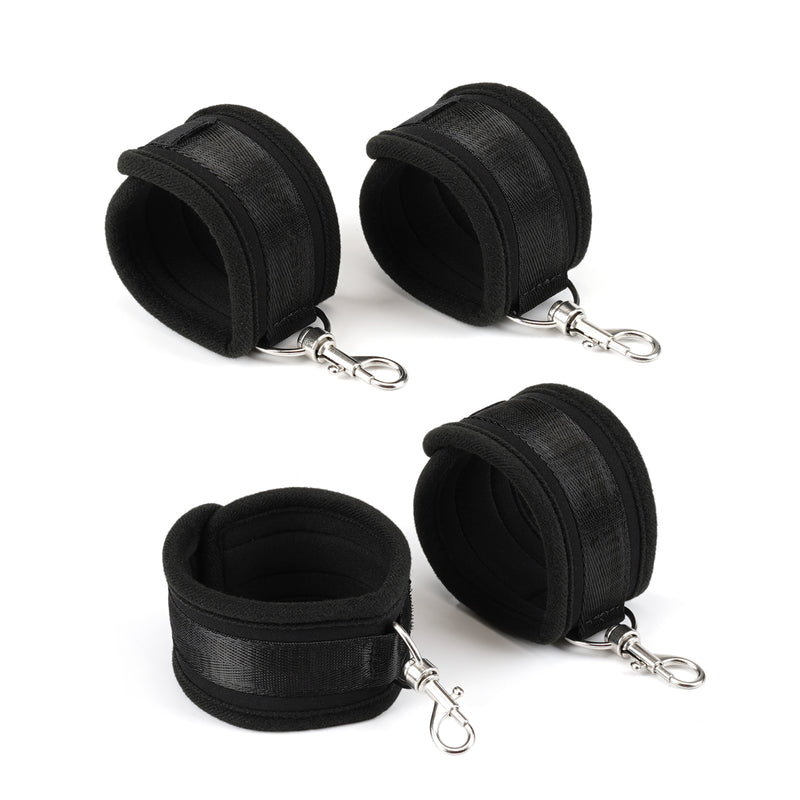 Durable black neoprene wrist and ankle cuffs with metal clips for secure bondage play, part of the Bound You Essentials Beginner's Bondage Kit.
